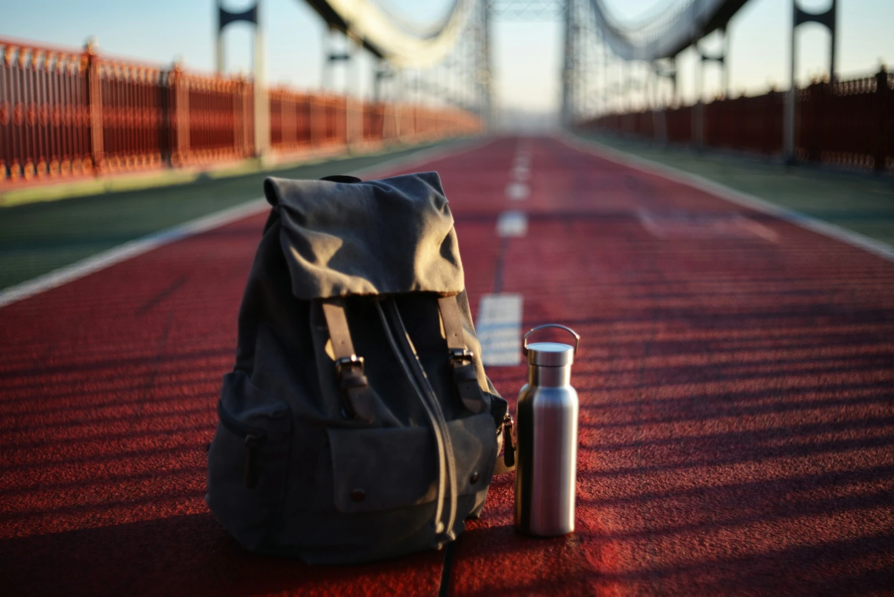 A daypack and reusable water bottle ready for a walk