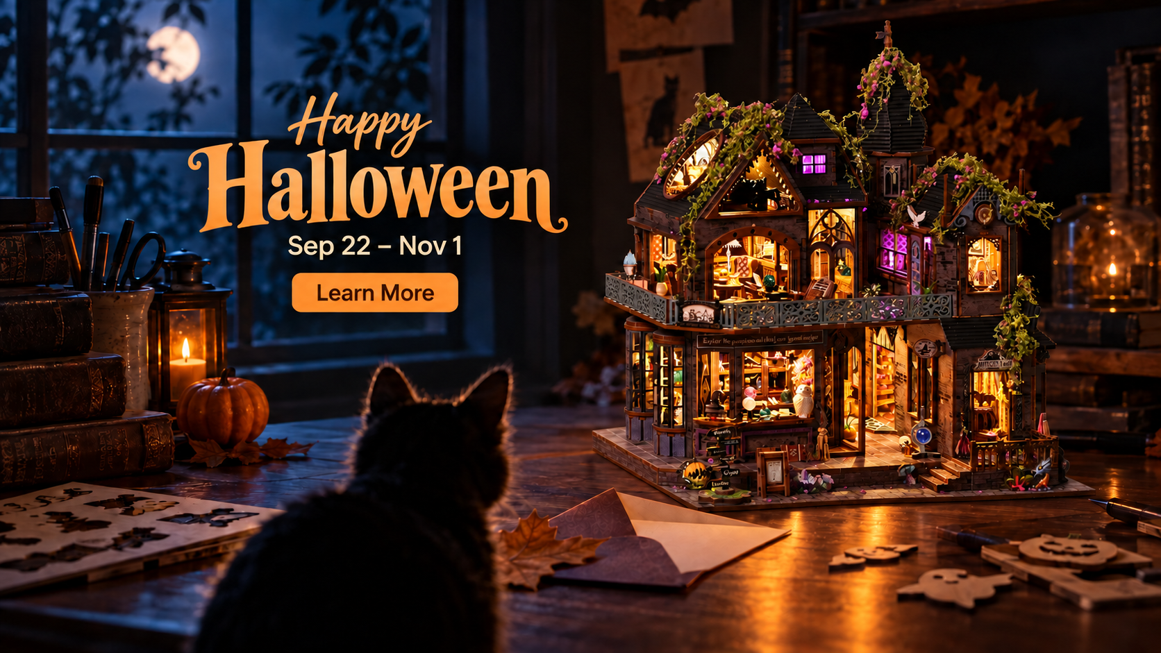 Happy Halloween miniature castle glowing at night while a black cat watches from a workshop